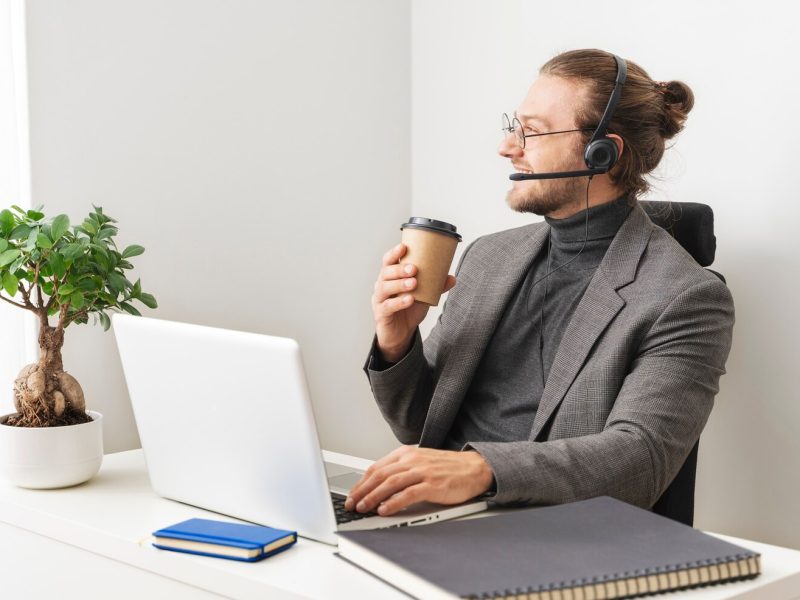medium-shot-smiley-man-desk_23-2149271194
